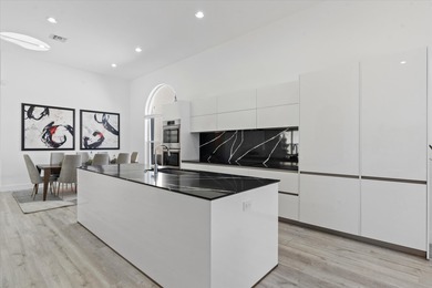 Stunningly renovated home located on two fairways of the Eagle on TPC Eagle Trace in Florida - for sale on GolfHomes.com, golf home, golf lot