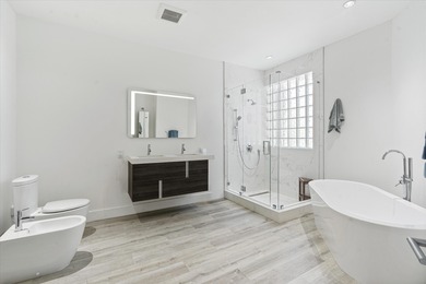 Stunningly renovated home located on two fairways of the Eagle on TPC Eagle Trace in Florida - for sale on GolfHomes.com, golf home, golf lot