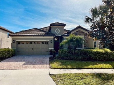 Under contract-accepting backup offers. New reduced price! on The Oasis Club at Champions Gate in Florida - for sale on GolfHomes.com, golf home, golf lot