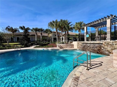 Under contract-accepting backup offers. New reduced price! on The Oasis Club at Champions Gate in Florida - for sale on GolfHomes.com, golf home, golf lot