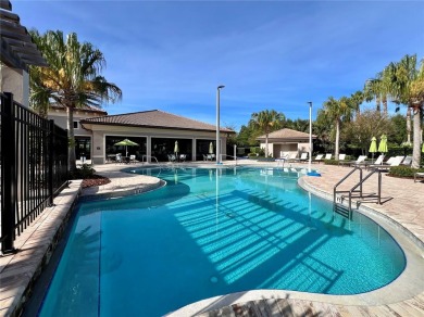 Under contract-accepting backup offers. New reduced price! on The Oasis Club at Champions Gate in Florida - for sale on GolfHomes.com, golf home, golf lot