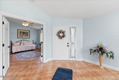 This golf community Florida Home is located on the 11th fairway on The Grand Club - Pine Lakes Course in Florida - for sale on GolfHomes.com, golf home, golf lot