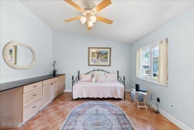 This golf community Florida Home is located on the 11th fairway on The Grand Club - Pine Lakes Course in Florida - for sale on GolfHomes.com, golf home, golf lot