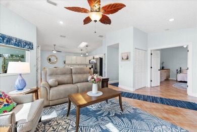 This golf community Florida Home is located on the 11th fairway on The Grand Club - Pine Lakes Course in Florida - for sale on GolfHomes.com, golf home, golf lot