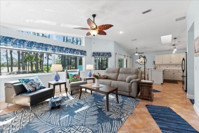 This golf community Florida Home is located on the 11th fairway on The Grand Club - Pine Lakes Course in Florida - for sale on GolfHomes.com, golf home, golf lot