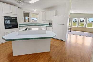 2 bed/2 bath, 1,384 sq ft of living space overlooking the Golf on Barefoot Bay Golf Course in Florida - for sale on GolfHomes.com, golf home, golf lot