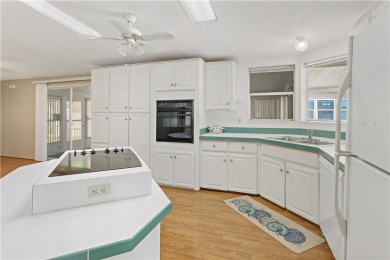 2 bed/2 bath, 1,384 sq ft of living space overlooking the Golf on Barefoot Bay Golf Course in Florida - for sale on GolfHomes.com, golf home, golf lot