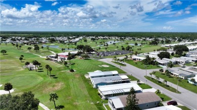 2 bed/2 bath, 1,384 sq ft of living space overlooking the Golf on Barefoot Bay Golf Course in Florida - for sale on GolfHomes.com, golf home, golf lot