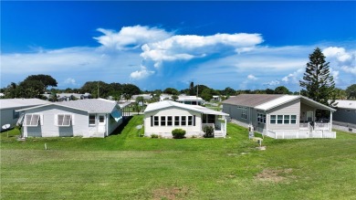 2 bed/2 bath, 1,384 sq ft of living space overlooking the Golf on Barefoot Bay Golf Course in Florida - for sale on GolfHomes.com, golf home, golf lot