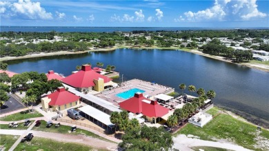 2 bed/2 bath, 1,384 sq ft of living space overlooking the Golf on Barefoot Bay Golf Course in Florida - for sale on GolfHomes.com, golf home, golf lot