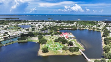 2 bed/2 bath, 1,384 sq ft of living space overlooking the Golf on Barefoot Bay Golf Course in Florida - for sale on GolfHomes.com, golf home, golf lot