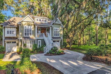 Nestled under a canopy of centuries old Angel Live Oak trees on Willbrook Plantation Golf Club in South Carolina - for sale on GolfHomes.com, golf home, golf lot