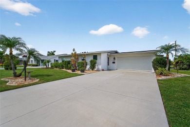 Presenting this custom-built residence overlooking the tranquil on North Lakes Golf Course in Florida - for sale on GolfHomes.com, golf home, golf lot