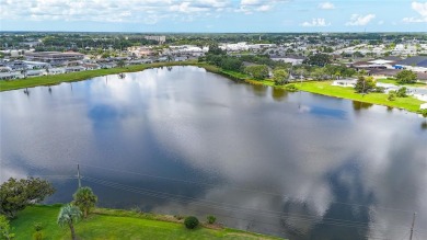 Presenting this custom-built residence overlooking the tranquil on North Lakes Golf Course in Florida - for sale on GolfHomes.com, golf home, golf lot