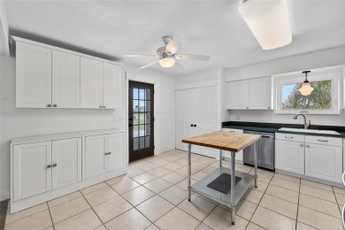 Presenting this custom-built residence overlooking the tranquil on North Lakes Golf Course in Florida - for sale on GolfHomes.com, golf home, golf lot