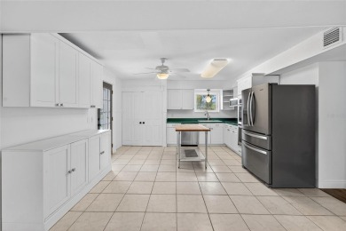 Presenting this custom-built residence overlooking the tranquil on North Lakes Golf Course in Florida - for sale on GolfHomes.com, golf home, golf lot