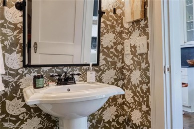 Welcome to 820 Wilson Road, a truly stunning Tudor-style home on Bobby Jones Golf Club in Georgia - for sale on GolfHomes.com, golf home, golf lot