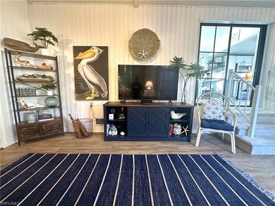 This charming cottage-style mobile home is located in the serene on Copperleaf Golf Club in Florida - for sale on GolfHomes.com, golf home, golf lot