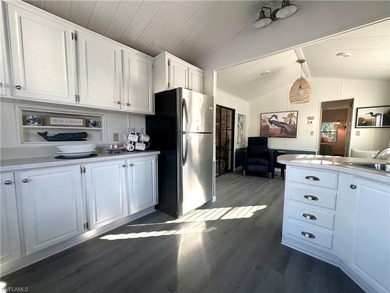 This charming cottage-style mobile home is located in the serene on Copperleaf Golf Club in Florida - for sale on GolfHomes.com, golf home, golf lot