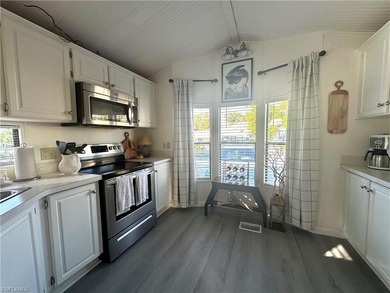 This charming cottage-style mobile home is located in the serene on Copperleaf Golf Club in Florida - for sale on GolfHomes.com, golf home, golf lot