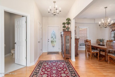 Experience luxury living in this exquisite home nestled in the on Sound Golf Links at Albemarle Plantation in North Carolina - for sale on GolfHomes.com, golf home, golf lot