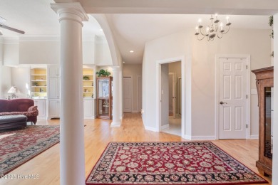 Experience luxury living in this exquisite home nestled in the on Sound Golf Links at Albemarle Plantation in North Carolina - for sale on GolfHomes.com, golf home, golf lot