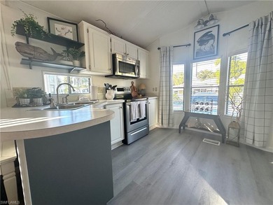 This charming cottage-style mobile home is located in the serene on Copperleaf Golf Club in Florida - for sale on GolfHomes.com, golf home, golf lot