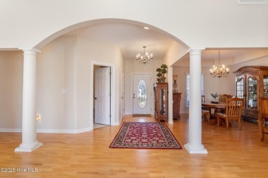 Experience luxury living in this exquisite home nestled in the on Sound Golf Links at Albemarle Plantation in North Carolina - for sale on GolfHomes.com, golf home, golf lot