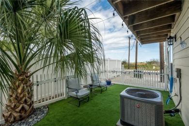 This four bedroom, three bathroom end unit at Gulfside Condos is on Palmilla Beach Golf Club in Texas - for sale on GolfHomes.com, golf home, golf lot