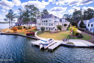 The house is situated on the picturesque Lake Auman, a on Beacon Ridge Golf and Country Club in North Carolina - for sale on GolfHomes.com, golf home, golf lot