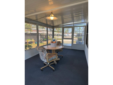 This lovely, manufactured home on leased land is located in Lake on Pine Lakes Country Club in Florida - for sale on GolfHomes.com, golf home, golf lot