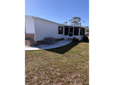 This lovely, manufactured home on leased land is located in Lake on Pine Lakes Country Club in Florida - for sale on GolfHomes.com, golf home, golf lot
