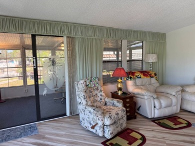 This lovely, manufactured home on leased land is located in Lake on Pine Lakes Country Club in Florida - for sale on GolfHomes.com, golf home, golf lot