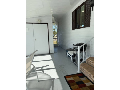 This lovely, manufactured home on leased land is located in Lake on Pine Lakes Country Club in Florida - for sale on GolfHomes.com, golf home, golf lot