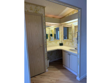 This lovely, manufactured home on leased land is located in Lake on Pine Lakes Country Club in Florida - for sale on GolfHomes.com, golf home, golf lot