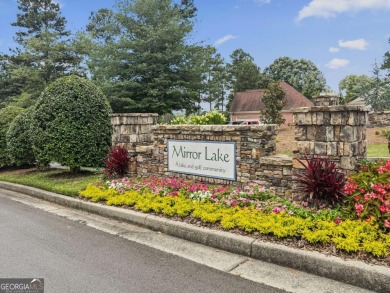 Welcome to your dream home in the sought-after Mirror Lake golf on Mirror Lake Golf Club in Georgia - for sale on GolfHomes.com, golf home, golf lot