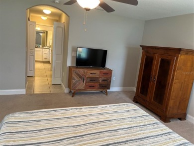 This spacious home is located between two golf courses and two on The Grand Club Cypress Course in Florida - for sale on GolfHomes.com, golf home, golf lot