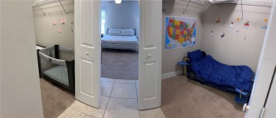 This spacious home is located between two golf courses and two on The Grand Club Cypress Course in Florida - for sale on GolfHomes.com, golf home, golf lot