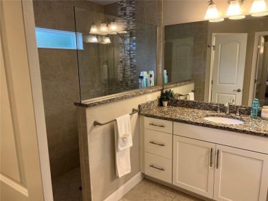 This spacious home is located between two golf courses and two on The Grand Club Cypress Course in Florida - for sale on GolfHomes.com, golf home, golf lot