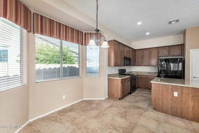 Set on a huge, nearly 12,000-square-foot lot backing to pristine on Estrella Mountain Ranch Golf Course in Arizona - for sale on GolfHomes.com, golf home, golf lot