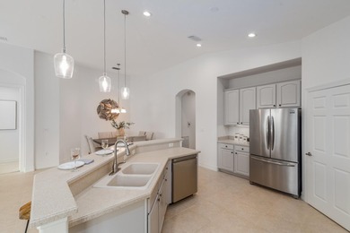 GORGEOUS corner unit - light, bright, and elevated for panoramic on Hammock Bay in Florida - for sale on GolfHomes.com, golf home, golf lot