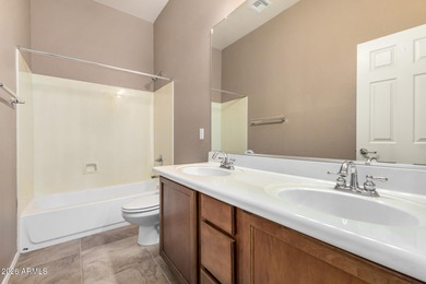 Set on a huge, nearly 12,000-square-foot lot backing to pristine on Estrella Mountain Ranch Golf Course in Arizona - for sale on GolfHomes.com, golf home, golf lot