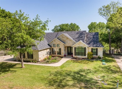 RIVERFRONT BEAUTY IN PECAN PLANTATION. Custom-built 4-3-3 stone on Nutcracker Golf Club in Texas - for sale on GolfHomes.com, golf home, golf lot