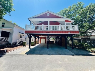 NEW LISTING! STUNNING 3 BED/2 BATH RAISED BEACH HOUSE WITH TONS on Prestwick Country Club in South Carolina - for sale on GolfHomes.com, golf home, golf lot