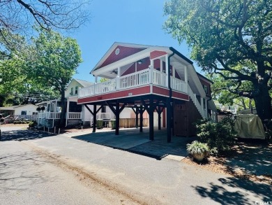 NEW LISTING! STUNNING 3 BED/2 BATH RAISED BEACH HOUSE WITH TONS on Prestwick Country Club in South Carolina - for sale on GolfHomes.com, golf home, golf lot