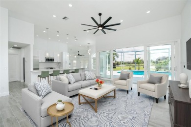 Immaculate Lakefront Pool Home in Prestigious Burnt Store Isles on Twin Isles Country Club in Florida - for sale on GolfHomes.com, golf home, golf lot