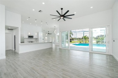 Immaculate Lakefront Pool Home in Prestigious Burnt Store Isles on Twin Isles Country Club in Florida - for sale on GolfHomes.com, golf home, golf lot