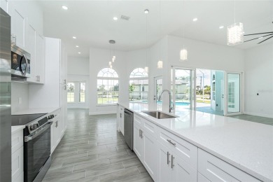 Immaculate Lakefront Pool Home in Prestigious Burnt Store Isles on Twin Isles Country Club in Florida - for sale on GolfHomes.com, golf home, golf lot