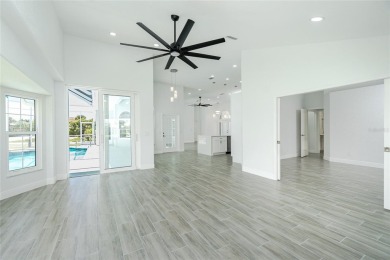 Immaculate Lakefront Pool Home in Prestigious Burnt Store Isles on Twin Isles Country Club in Florida - for sale on GolfHomes.com, golf home, golf lot