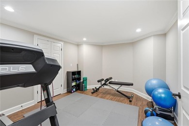 Discover an exceptional home in the highly sought-after, gated on Alpharetta Athletic Club East in Georgia - for sale on GolfHomes.com, golf home, golf lot